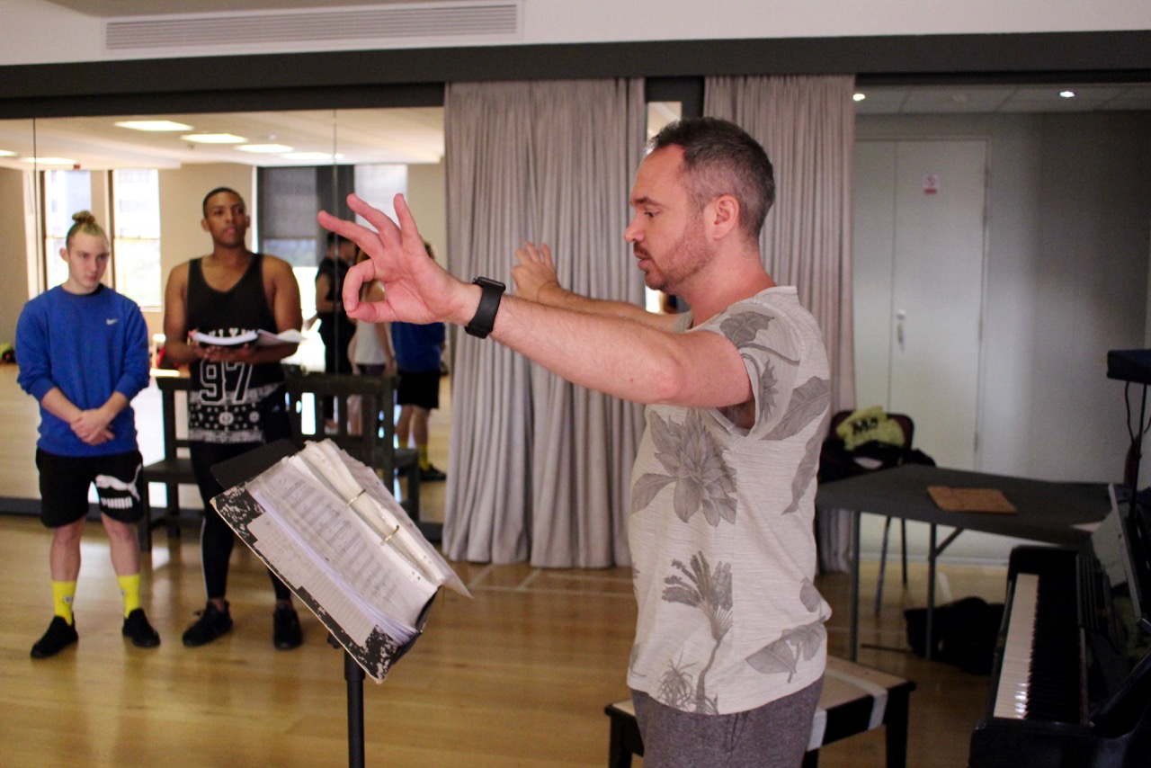 Musical director Garth Tavares, with Devin Butterworth and Nathan Muller, rehearse for THE PRODUCERS
